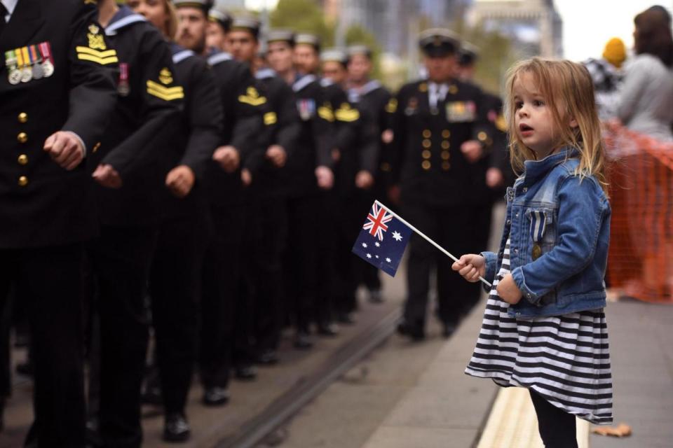 A young girl watches sailors march during the Anzac Day parade in Melbourne (AFP/Getty Images)