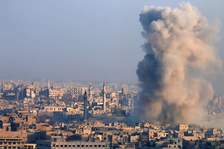 Smoke rises as seen from a governement-held area of Aleppo, Syria December 12, 2016. REUTERS/Omar Sanadiki