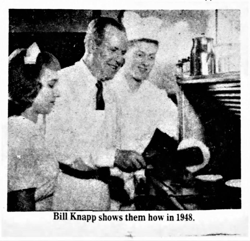 In this 1948 photo, Bill Knapp (center) shows his staff his culinary techniques.