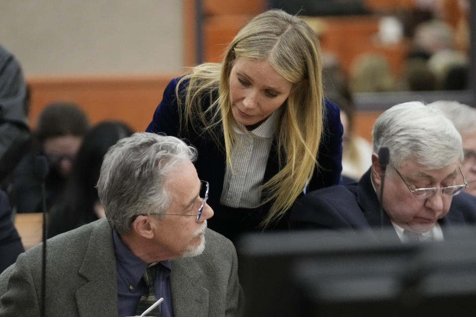 Gwyneth Paltrow speaks with retired optometrist Terry Sanderson, left, as she walks out of the courtroom following the reading of the verdict in their lawsuit trial, Thursday, March 30, 2023, in Park City, Utah. Paltrow won her court battle over a 2016 ski collision at a posh Utah ski resort after a jury decided Thursday that the movie star wasn’t at fault for the crash. (AP Photo/Rick Bowmer, Pool)