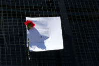 A ballot paper is seen attached on a Mossos d'Esquadra's riot van outside the Catalan region's economy ministry building during a raid by Spanish police on several government offices, in Barcelona, Spain, September 20, 2017. REUTERS/Albert Gea