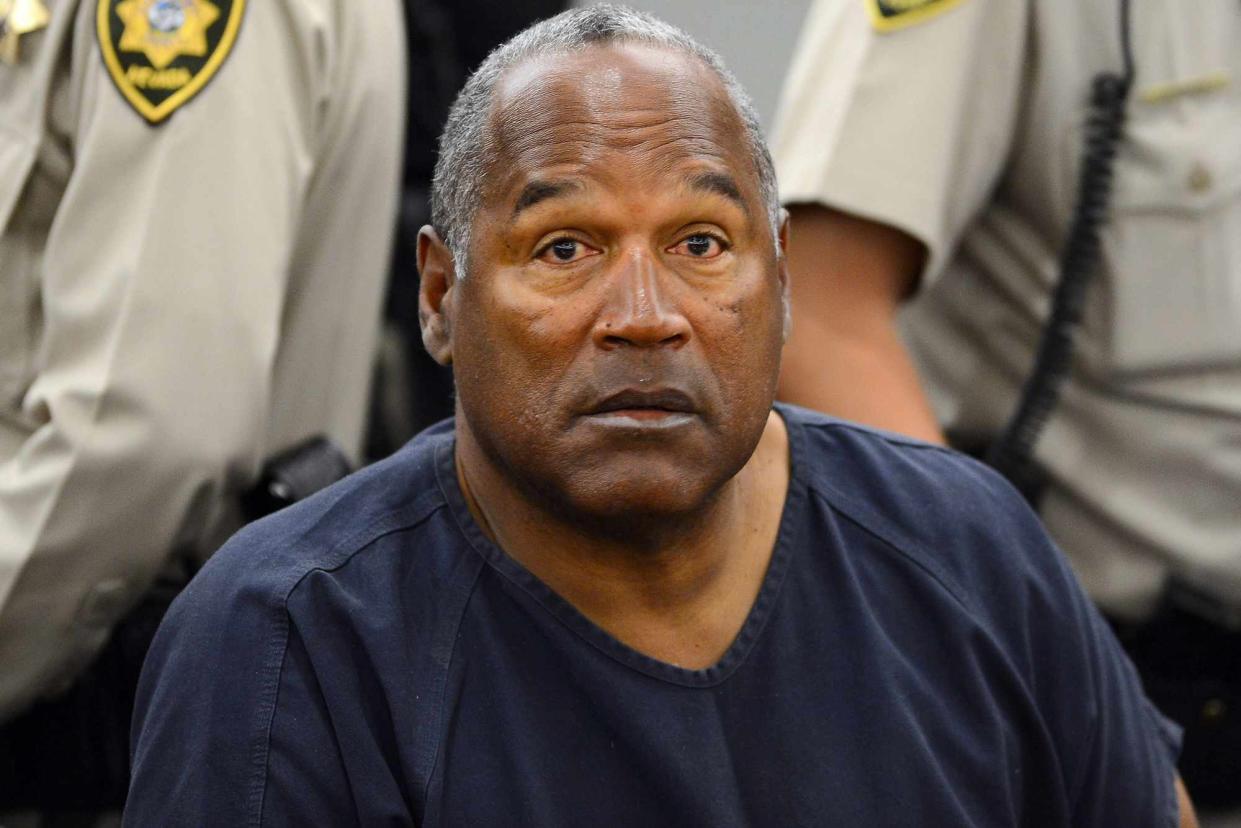 <p>Ethan Miller/Getty</p> O.J. Simpson in Clark County District Court on May 14, 2013