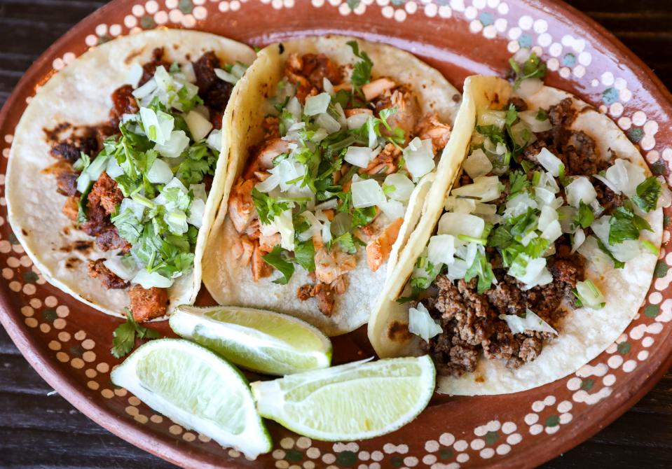 Al Pastor, chicken and ground beef tacos are served at El Ranchero Market in Salem, Ore.