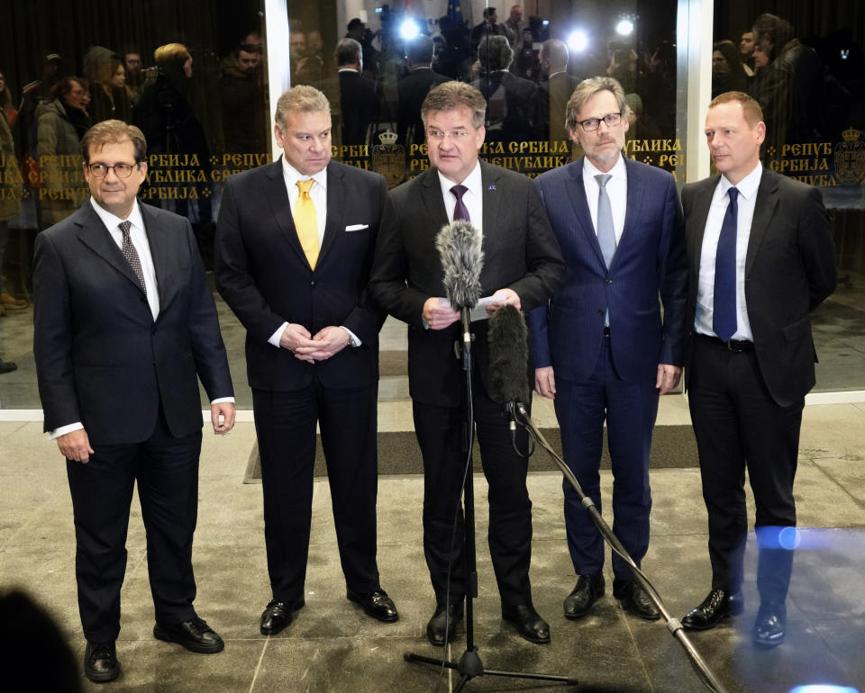 European Union envoy Miroslav Lajcak, center, addresses to the media with Francesco Talo, advisor to the Prime Minister of Italy Giorgia Meloni, left, U.S. Deputy Assistant Secretary Gabriel Escobar, second left, Jens Plettner, advisor of German Chancellor Olaf Scholz, second right, and Emanuel Bonne, advisor of French President Emmanuel Macron, right, after meeting with Serbian President Aleksandar Vucic, in Belgrade, Serbia, Friday, Jan. 20, 2023. Western envoys on Friday were visiting Kosovo and Serbia as part of their ongoing efforts to defuse tensions and help secure a reconciliation agreement between the two. (AP Photo/Darko Vojinovic)