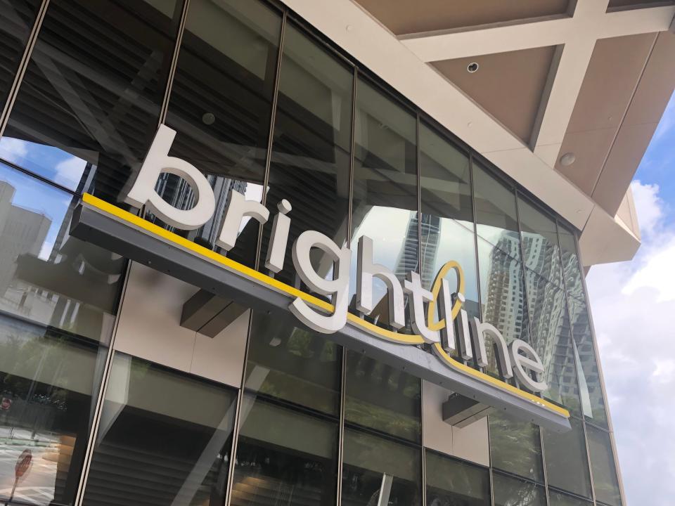 The Brightline logo on a glass building. 