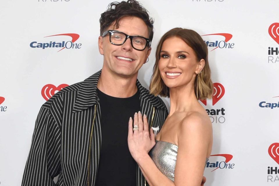 <p>Dave Pedley/Getty</p> Bobby Bones and Caitlin Parker in 2023