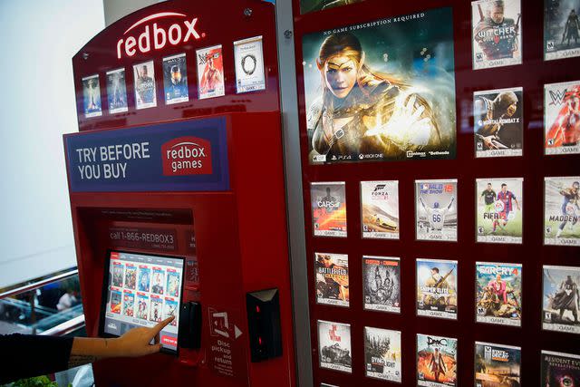 <p>Patrick T. Fallon/getty</p> Stock image of a Redbox rental kiosk