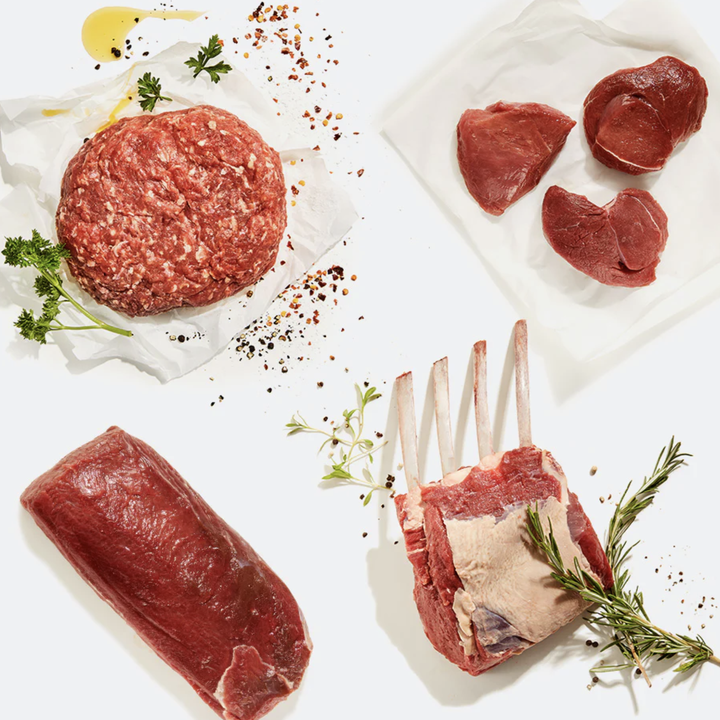 Various deer meat on white background