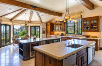 Celebrity chef Wolfgang Puck designed this kitchen, which includes both indoor and outdoor dining areas. (The Agency)
