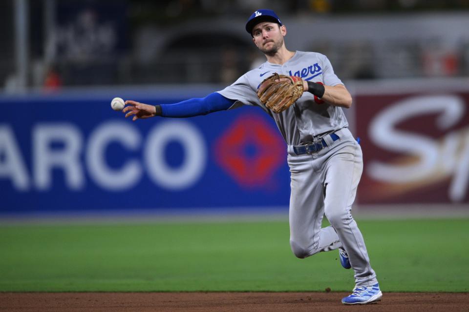 Dodgers shortstop Trea Turner throws to first for an out in the seventh inning against the Padres during Game 3 of their NL division series at Petco Park in San Diego on Oct. 14, 2022.