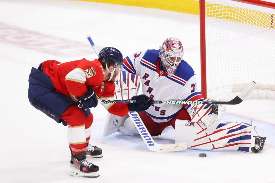 SUNRISE, FLORIDA - JUNE 01: Igor Shesterkin #31 of the New York Rangers saves the puck in front of Matthew Tkachuk #19 of the Florida Panthers during the second period in Game Six of the Eastern Conference Final of the 2024 Stanley Cup Playoffs at Amerant Bank Arena on June 01, 2024 in Sunrise, Florida.