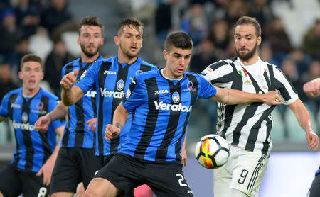 Soccer Football - Serie A - Juventus vs Atalanta - Allianz Stadium, Turin, Italy - March 14, 2018 Juventus’ Gonzalo Higuain in action with Atalanta's Gianluca Mancini REUTERS/Massimo Pinca