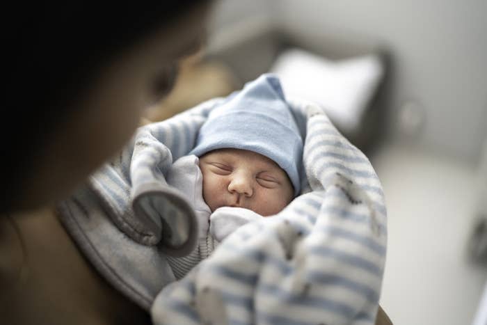 A baby all bundled up in the hospital.