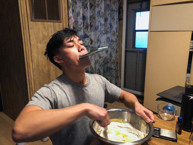Newton Nguyen recording a cooking video — anything for the bird's-eye-view shot. <span class="copyright">(Yvonne Nguyen / For The Times)</span>