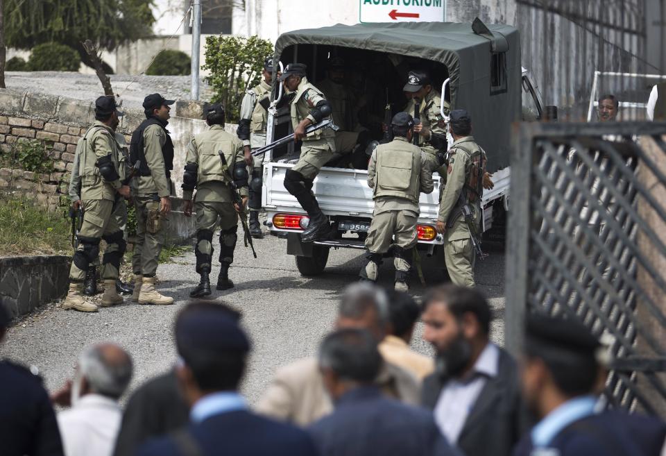 Soldiers of Pakistan's paramilitary force arrives at a special court set up for the trial of former President Pervez Musharraf, under tight security in Islamabad, Pakistan, Friday, March 14, 2014. Court trying the country’s former military ruler Musharraf for treason has asked police to arrest him if he fails to attend the next court hearing on March 31. (AP Photo/B.K. Bangash)