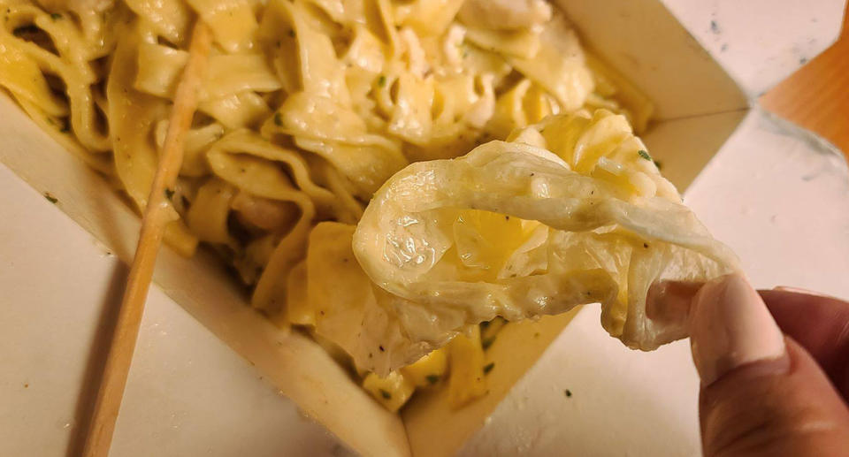 A couple found a latex glove "melted" in with their pasta. Source: Facebook
