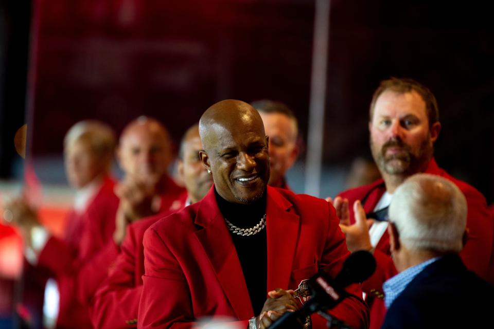 Reds Hall of Famer Eric Davis claps during the 2021 Reds Hall of Fame induction ceremony for Marty Brennaman on Friday, Aug. 27, 2021, at Great American Ball Park in Cincinnati. 