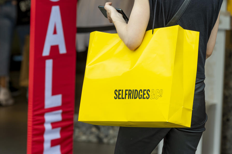 A woman is seen holding a selfridges shopping bag on London�s Oxford Street after the shops were allowed to reopen. (Photo by Dave Rushen / SOPA Images/Sipa USA)