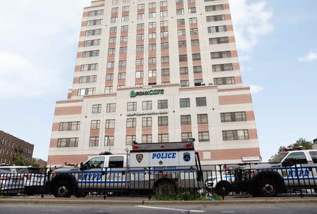 Police vehicles line the streets outside the hospital after an incident in which a gunman fired shots inside the Bronx-Lebanon Hospital in New York City, U.S. June 30, 2017. REUTERS/Brendan Mcdermid