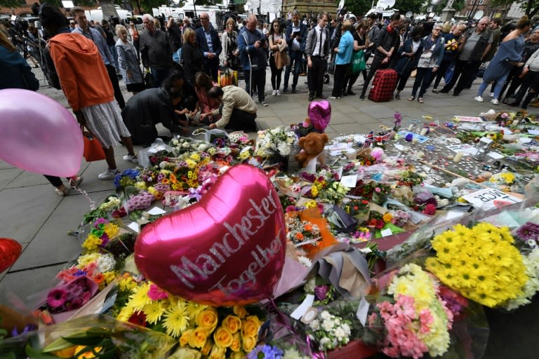 Ballons and flowers are seen in Albert Square in central Manchester, northwest England on May 24, 2017, placed in tribute to the victims of the May 22 terror attack at the Manchester Arena