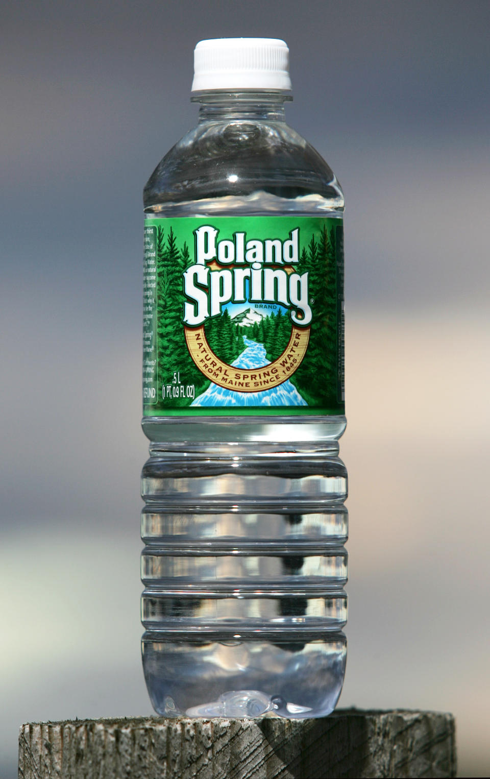 FILE - This Nov. 10, 2005, file photo shows a bottle of Poland Spring water in Fryeburg, Maine. Global food giant Nestle is selling its North American bottled-water brands for $4.3 billion to a pair of private-equity firms that hope to reinvigorate sales. Brands including Poland Spring, Deer Park, Arrowhead and Pure Life will be sold to a subsidiary of One Rock Capital Partners in partnership with Metropoulos & Co. The deal is expected to close in spring 2021. (AP Photo/Robert F. Bukaty, File)