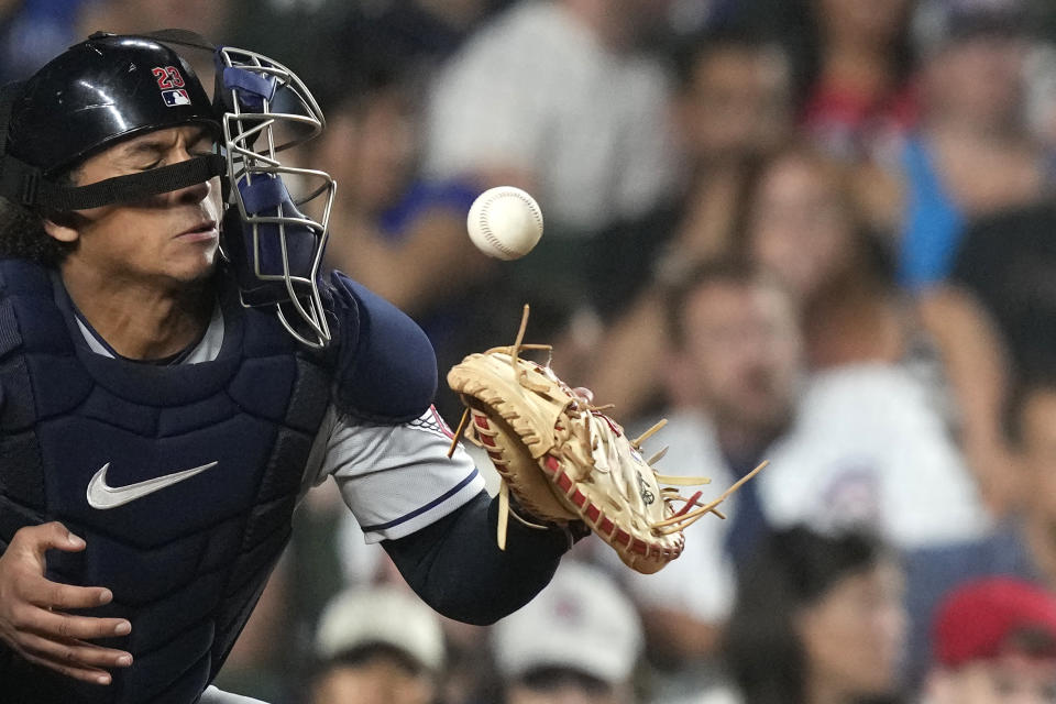 Cleveland Guardians catcher Bo Naylor is hit on the mask by a ball fouled off by Chicago Cubs' Seiya Suzuki during the fourth inning of a baseball game Saturday, July 1, 2023, in Chicago. (AP Photo/Charles Rex Arbogast)