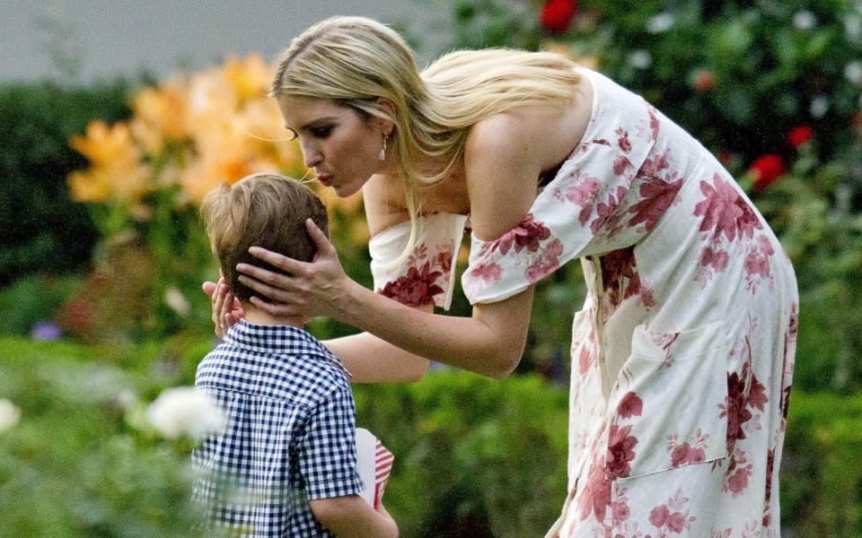  Ivanka Trump kisses one of her sons in the Rose Garden at the annual Congressional Picnic - Credit:  Ron Sachs/ Zuma Press / eyevine