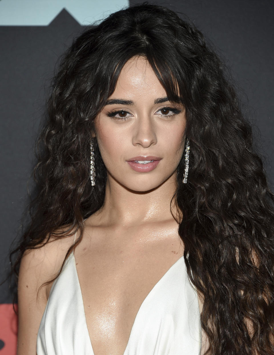 FILE - This Aug. 26, 2019 file photo shows Camila Cabello at the MTV Video Music Awards in Newark, N.J. Cabello is apologizing for past racist language she used on social media. The Grammy-nominated singer wrote on Wednesday that she is sorry for using offensive and hurtful words on social media as a teen, and now that she is 22, she has grown up. (Photo by Evan Agostini/Invision/AP, File)