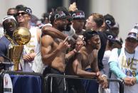 Denver Nuggets forward Bruce Brown, center left in front, poses with teammates during a rally to mark the Denver Nuggets first NBA basketball championship Thursday, June 15, 2023, in Denver. (AP Photo/Jack Dempsey)