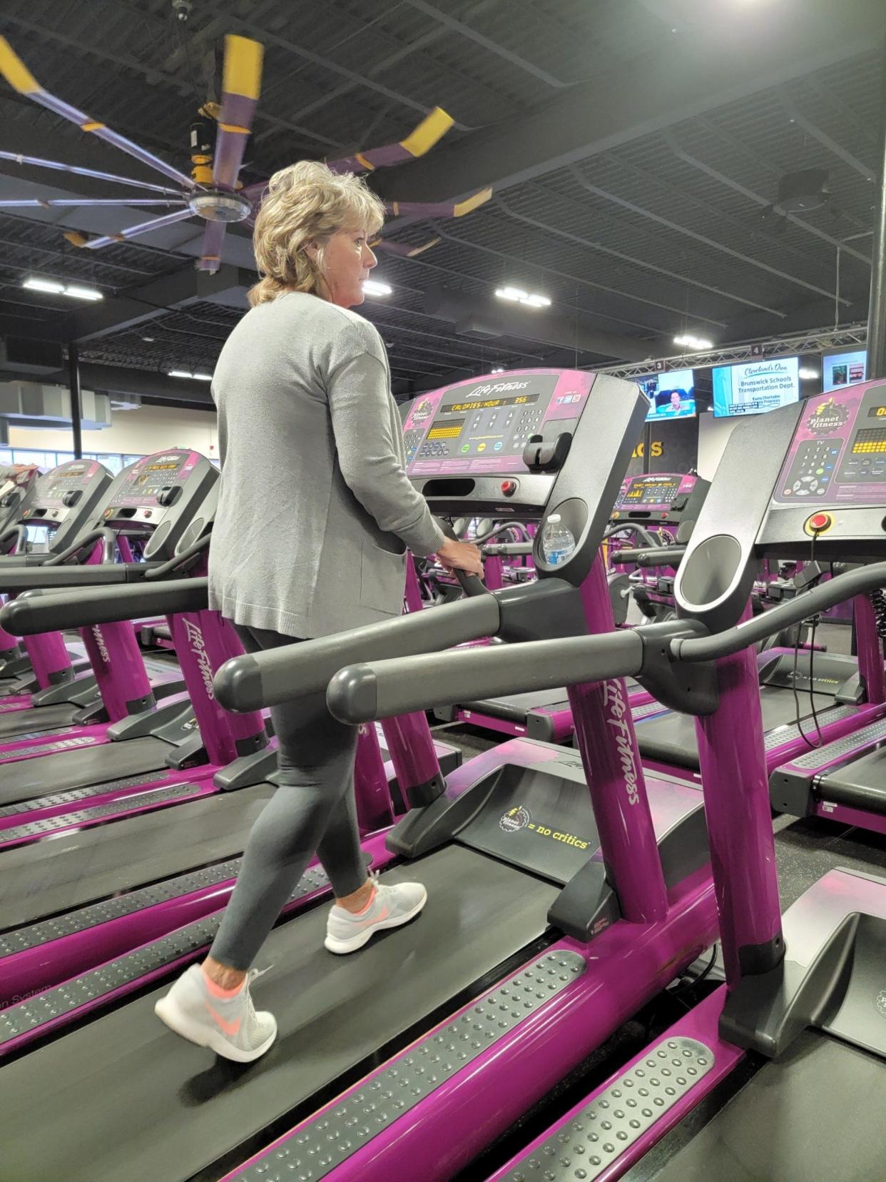 Beckie Dean walks on a treadmill at Planet Fitness in Alliance.