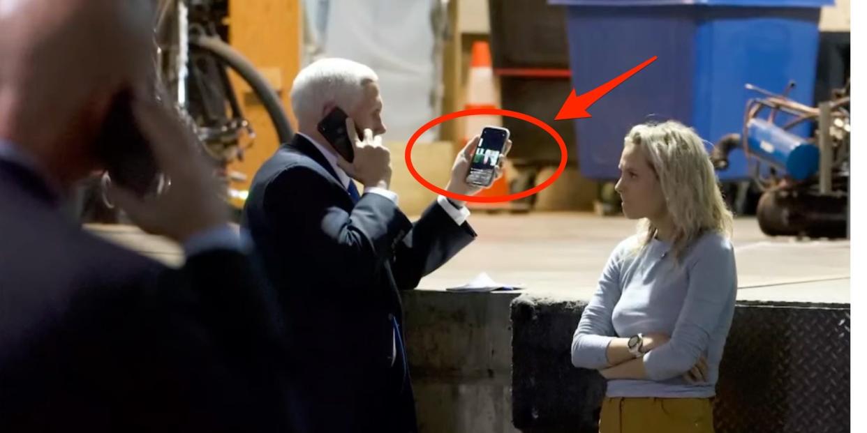 Vice President Mike Pence is seen holding a phone watching President Donald Trump tell the angry mob at the Capitol to leave on January 6, 2021.