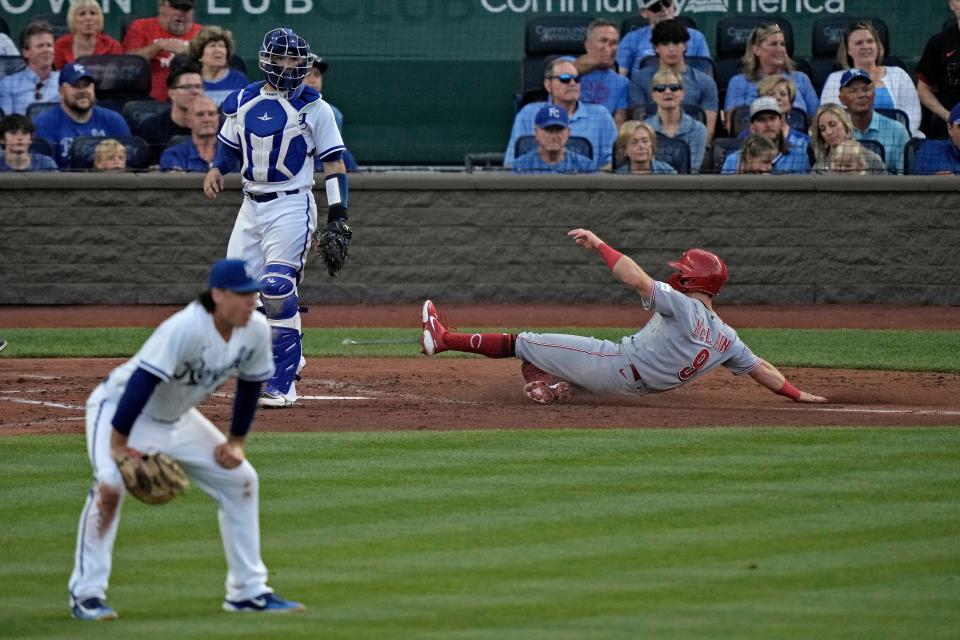 Cincinnati Reds' Matt McLain slides home to score on a double by Jonathan India during the fourth inning of a baseball game against the Kansas City Royals Wednesday, June 14, 2023, in Kansas City, Mo.