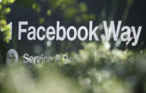 FILE - In this April 25, 2019, file photo an address sign for Facebook Way is shown in Menlo Park, Calif. Facebook unveiled a broad plan Tuesday, June 18, to create a new digital currency. (AP Photo/Jeff Chiu, File)