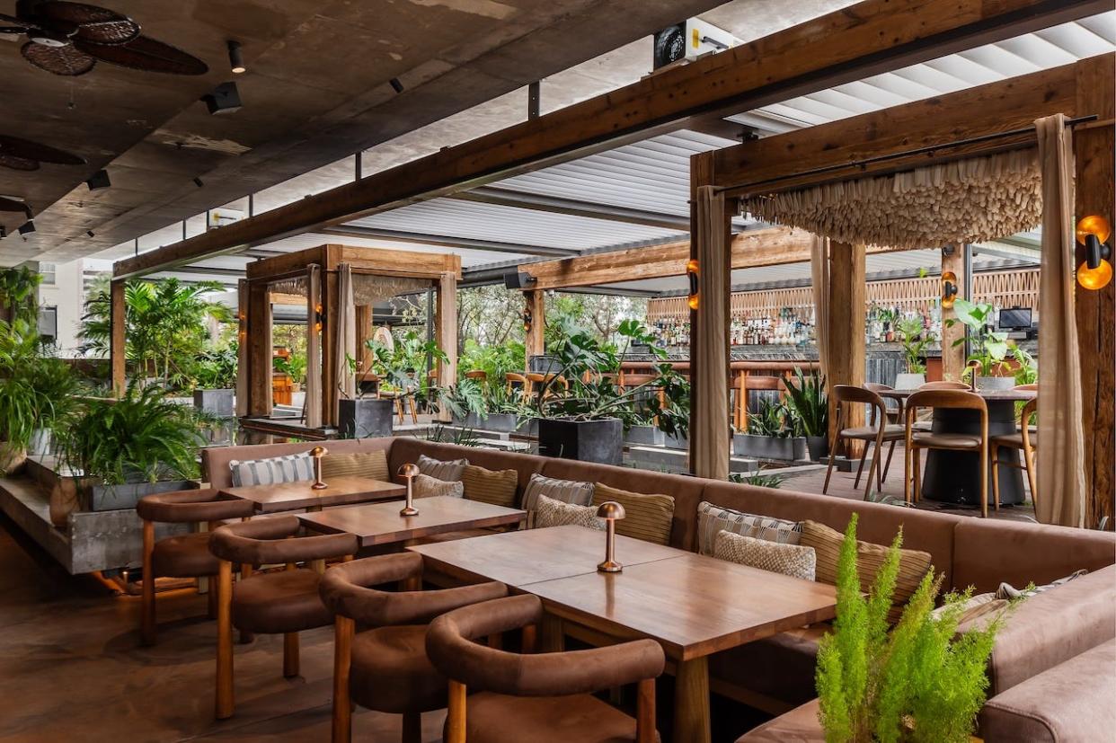 The indoor and outdoor seating areas of MILA Miami.