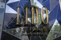 The logo of the cabaret « Le Lido » is pictured on the Champs-Elysees avenue in Paris, Wednesday, May 18, 2022. It’s the end of an era for the famed Lido cabaret on Paris’ Champs-Elysees. Amid financial troubles and changing times, the venue’s new corporate owner is ditching most of the Lido’s staff and its high-kicking, high-glamour dance shows. (AP Photo/Christophe Ena)