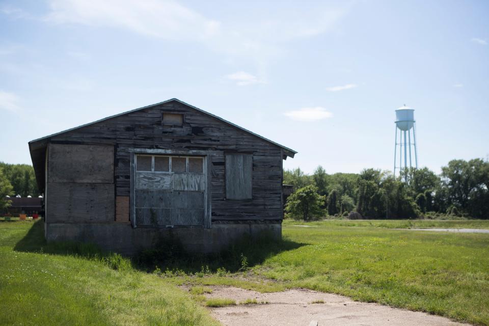 An abandoned building at Fort DuPont in Delaware City on Wednesday, May 18, 2022. In the years after the state converted the property into the Governor Bacon Health Center, hundreds of military buildings were lost.