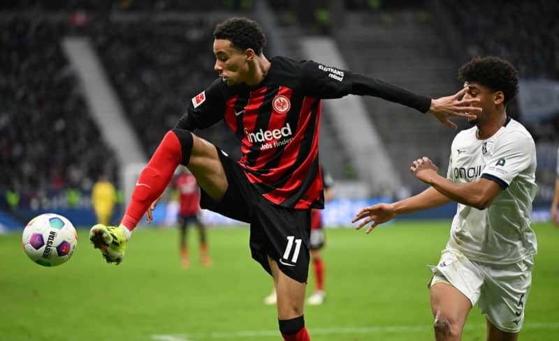 Frankfurt's Hugo Ekitike (L) and Bochum's Bernardo fight for the ball during the German Bundesliga soccer match between Eintracht Frankfurt and VfL Bochum at Deutsche Bank Park. Eintracht Frankfurt have signed forward Hugo Ekitike on a permanent deal from Paris Saint-Germain, the Bundesliga team said on Friday. Arne Dedert/dpa