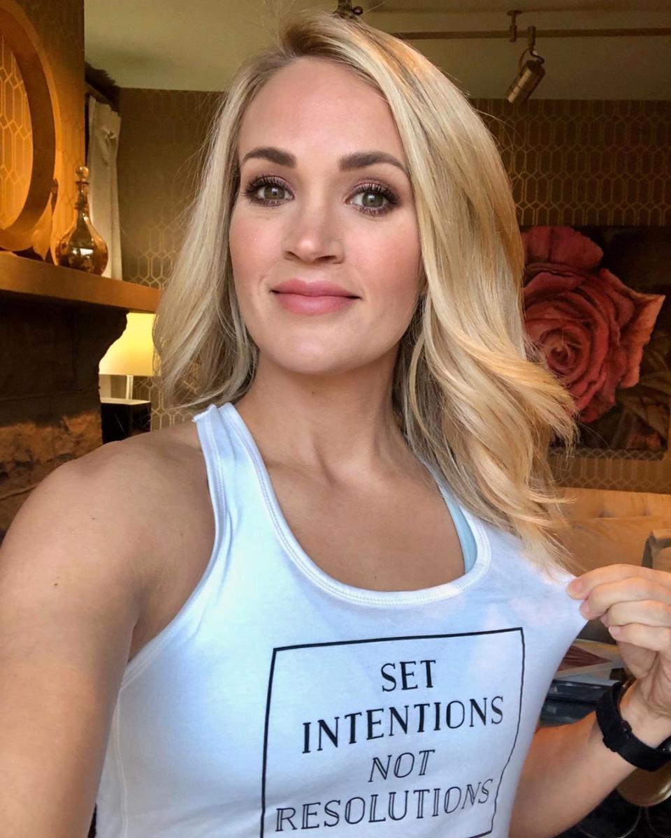 Carrie Underwood poses in a tank top