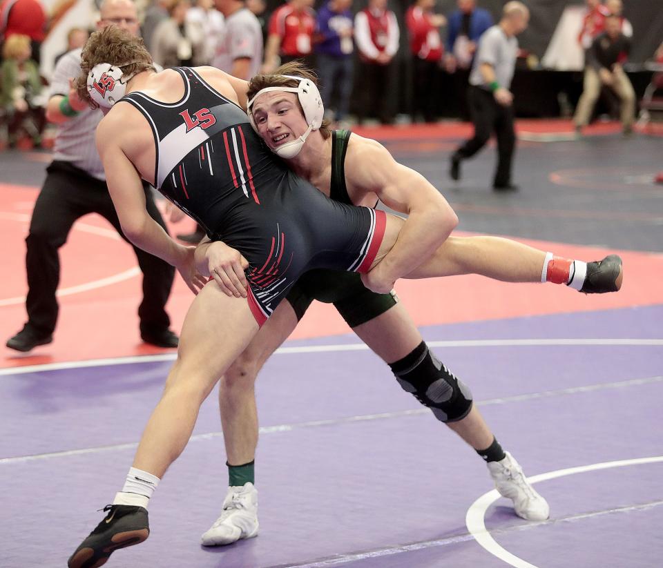GlenOak’s Brandon Batson works to take down LaSalle’s Chase Stein in their 175 matchup at the OHSAA State Tournament in Columbus Saturday, March 12, 2022.