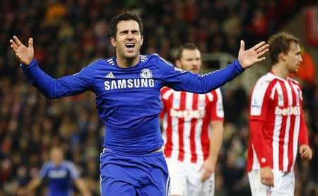 Chelsea's Cesc Fabregas celebrates after scoring the second goal during their English Premier League soccer match against Stoke City at the Britannia Stadium in Stoke-on-Trent, northern England December 22, 2014. REUTERS/Darren Staples