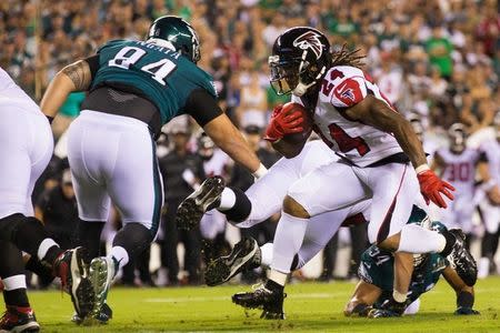 FILE PHOTO: Sep 6, 2018; Philadelphia, PA, USA; Atlanta Falcons running back Devonta Freeman (24) runs with the ball against Philadelphia Eagles defensive tackle Haloti Ngata (94) during the first quarter at Lincoln Financial Field. Mandatory Credit: Bill Streicher-USA TODAY Sports/File Photo