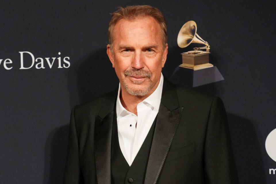 <p>Jeff Kravitz/FilmMagic</p> Kevin Costner attends the Pre-GRAMMY Gala on Feb. 4, 2023, in Beverly Hills, California