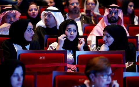 Saudis watch composer Yanni perform at Princess Nourah bint Abdulrahman University in Riyadh, Saudi Arabia,  - Credit: Reuters