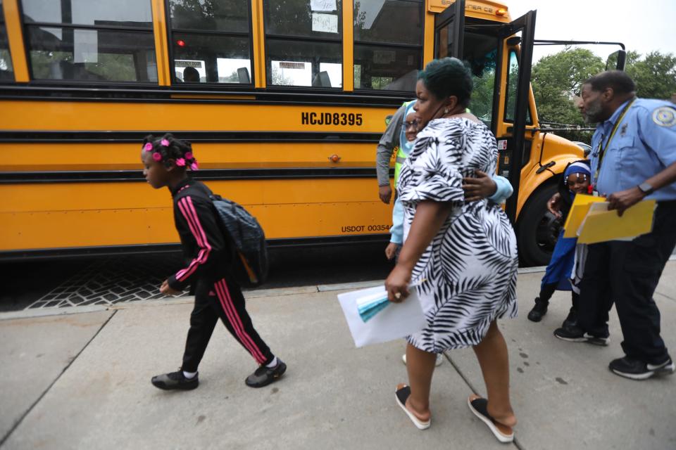 School 8 on St. Paul St.  in Rochester, NY started their first day of school today, September 7, 2022.  Staff hug and greet students as they get off the bus.