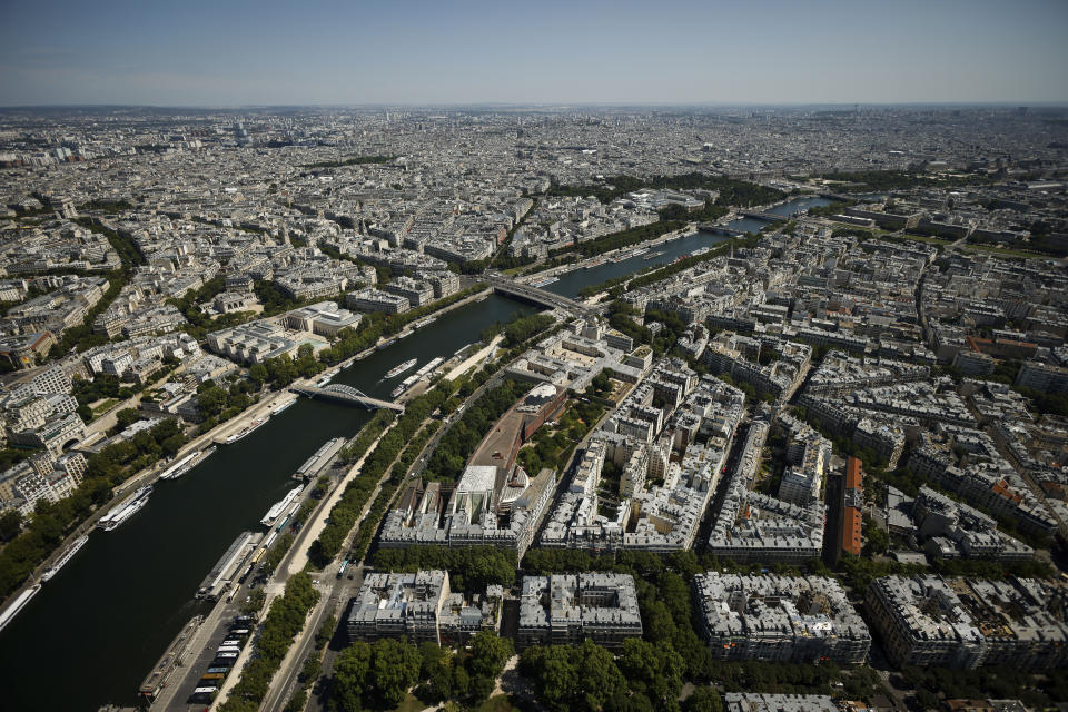 The Seine river flows through Paris Tuesday, July 11, 2023. Paris is on track to host millions of visitors and successfully stage 32 sporting events next year when the 2024 Olympics open on July 26. That's a welcome return to business as usual for the first post-pandemic Olympics. (AP Photo/Thomas Padilla)