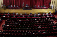 Parliament meets to confirm Lebanon's new government at a Beirut theater known as the UNESCO palace so that parliament members could observe social distancing measures imposed over the coronavirus pandemic, Lebanon, Monday, Sept. 20, 2021. A power outage and a broken generator briefly delayed the start of the parliament session for some 40 minutes before electricity came back on. (AP Photo/Bilal Hussein)