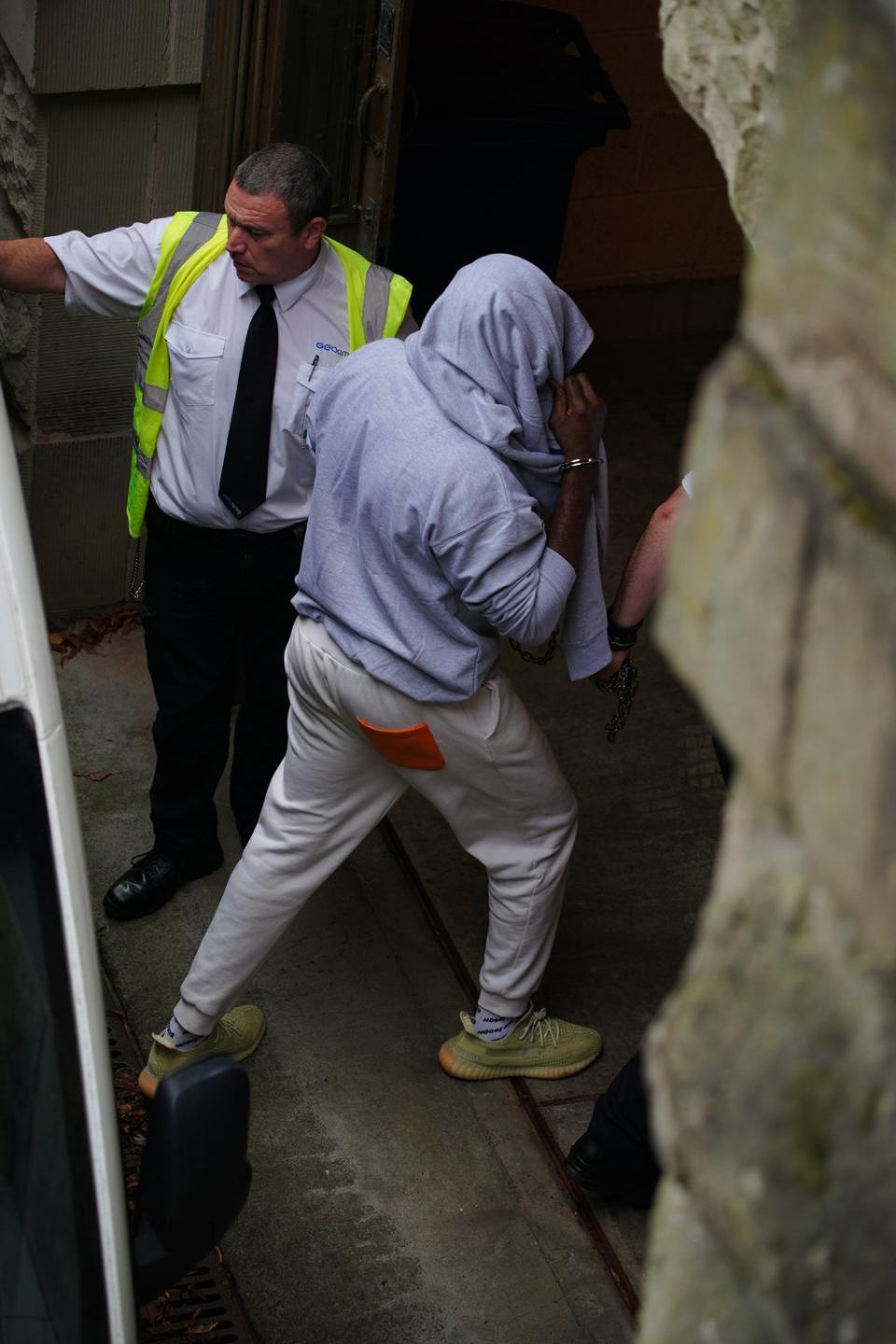 A man, believed to be co-defendant Louis Saha Matturie, gets out of a prison van at Chester Crown Court (Peter Byrne/PA) (PA Wire)