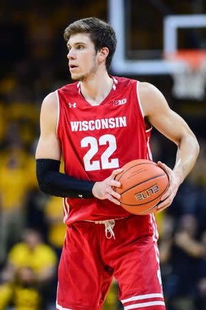 Nov 30, 2018; Iowa City, IA, USA; Wisconsin Badgers forward Ethan Happ (22) controls the ball against the Iowa Hawkeyes during the first half at Carver-Hawkeye Arena. Jeffrey Becker-USA TODAY Sports - 11761617