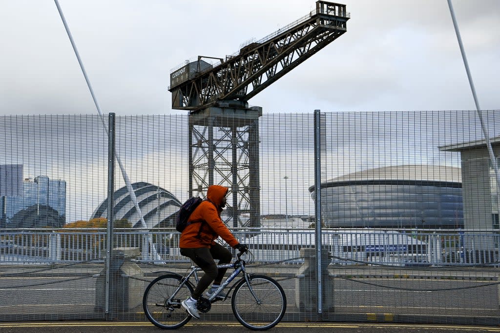 Members of the public make their way over the Clyde Arc Bridge following road closure restriction coming into place ahead of COP26 (Getty Images)