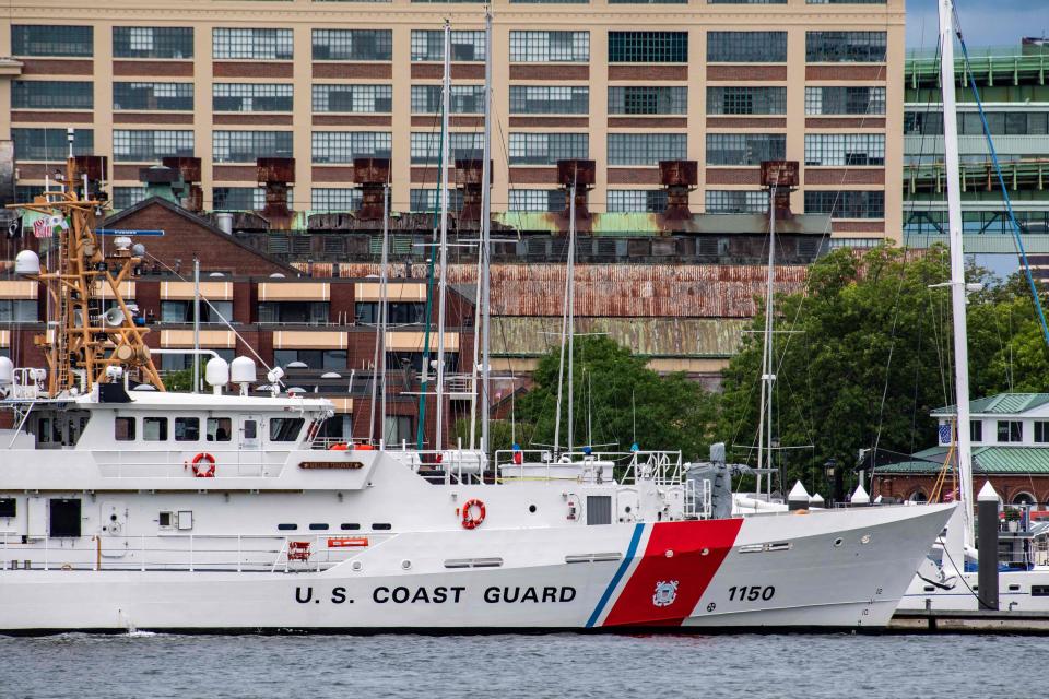 A U.S. Coast Guard vessel sits in port in Boston Harbor across from the U.S. Coast Guard Station Boston in Boston on Monday. A submersible vessel used to take tourists to see the wreckage of the Titanic in the North Atlantic has gone missing, triggering a search-and-rescue operation, the Coast Guard said.